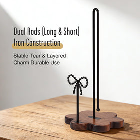 Three-part stable design with wood base and iron rods for durability.