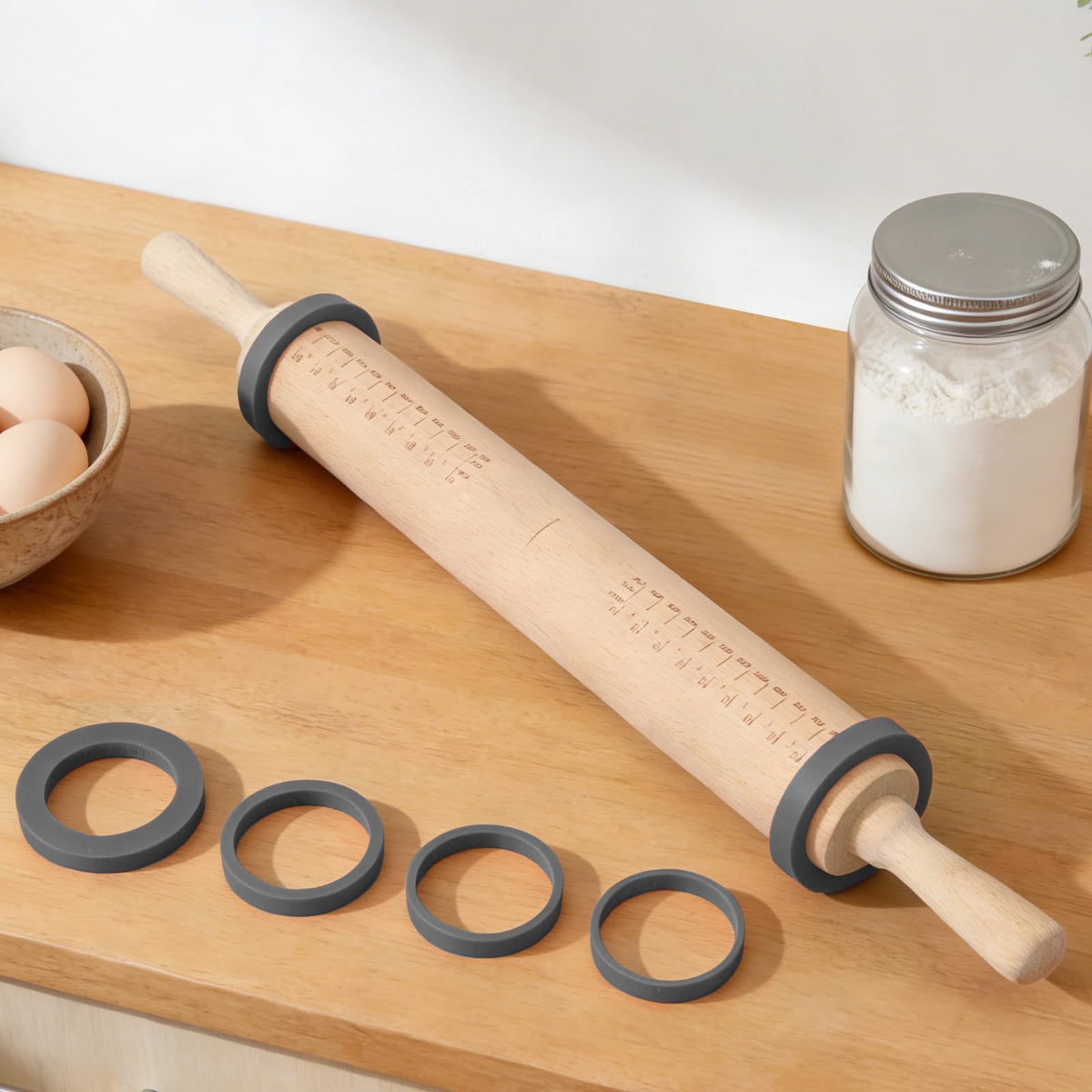 Toeusog rolling pin with measurement marks for precise dough sizing.