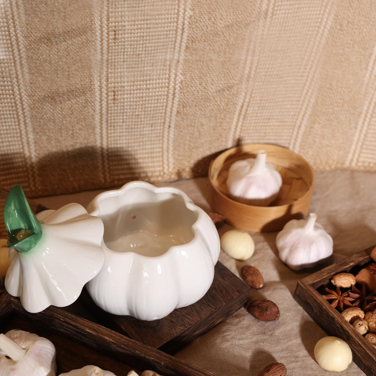 TOIVO sprouting-inspired garlic keeper adds playful kitchen charm.