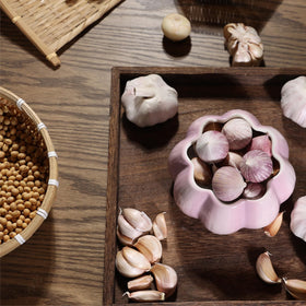 TOIVO garlic saver mimics garlic sprout shape for a playful kitchen accent