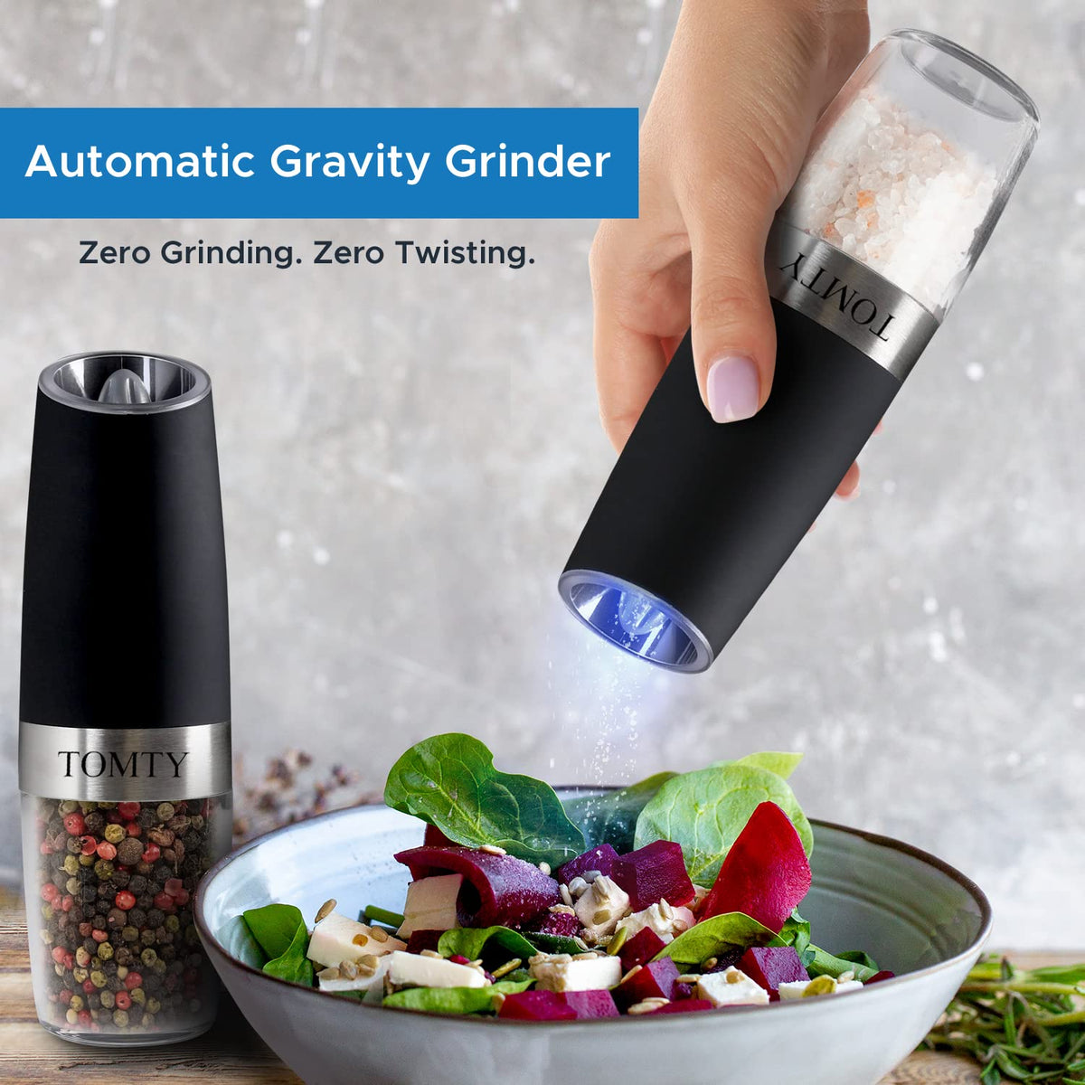 TOMTY grinder in use at table delivering consistent seasoning with tilt action.