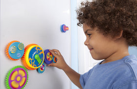 Toomies Gearation central gear battery-powered on fridge enables dynamic interactive play.