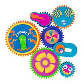 Toomies Gearation magnets on the fridge set for creative play and fine motor skills.