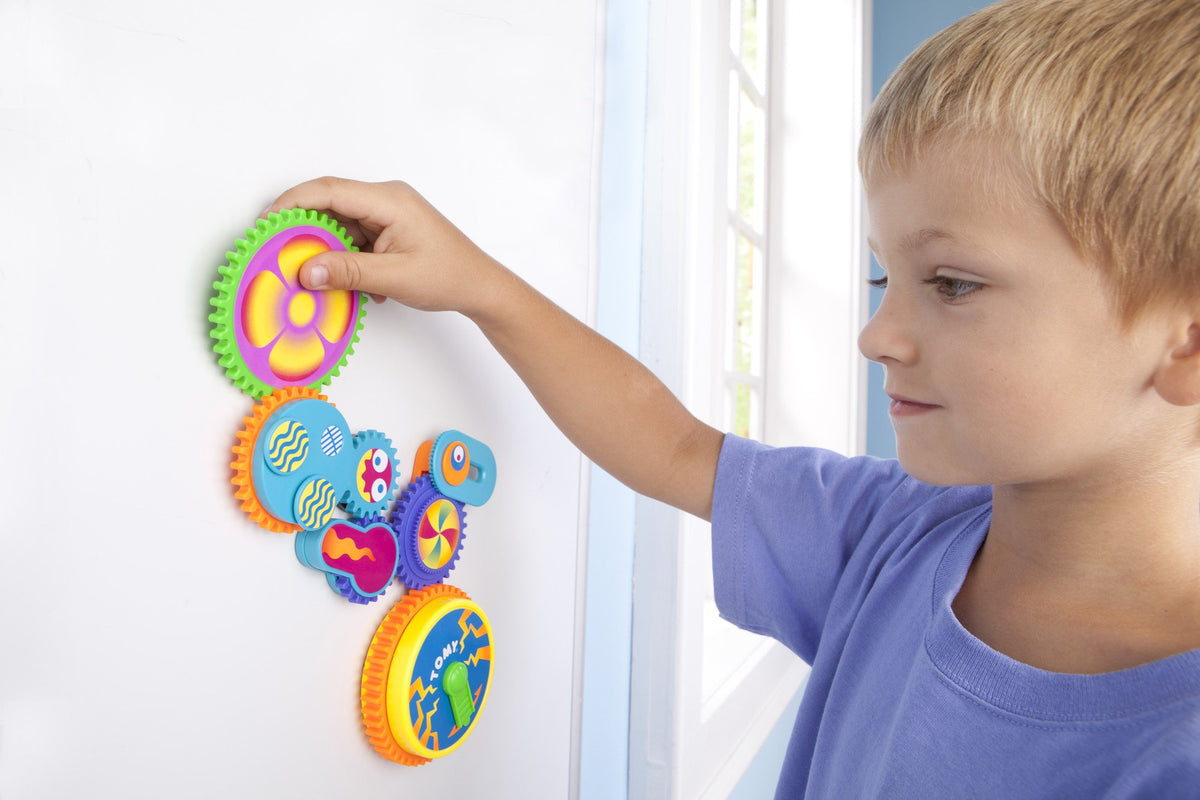 Toomies Gearation rotating gears on fridge invite imagination and planning in playtime.