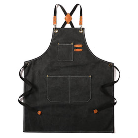 Tosewever canvas cross-back apron in black with adjustable straps for all-day comfort.