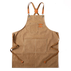 Tosewever canvas cross-back apron provides full coverage for kitchen and workshop tasks.