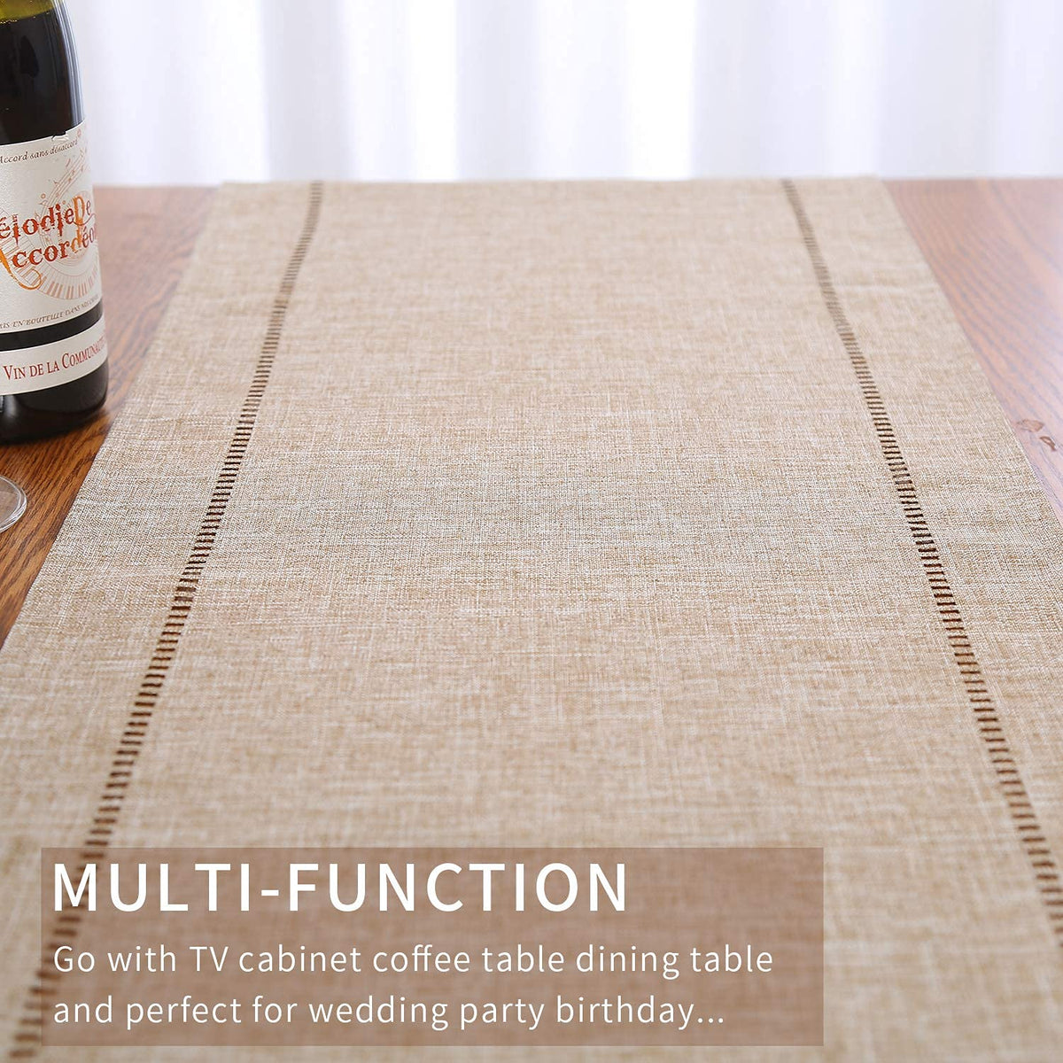 Tosewever table runner beside plates and glassware complements table decor.