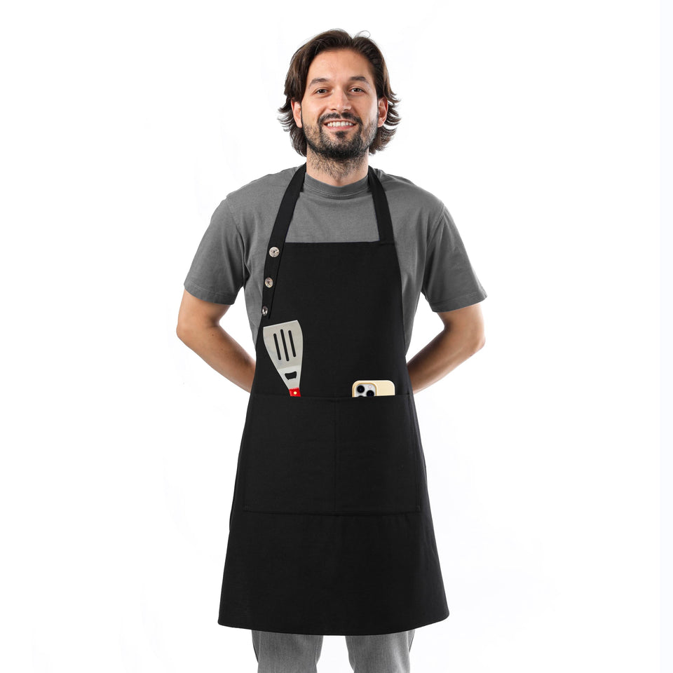 TOSHE waterdrop-resistant cotton apron in black protects clothing during cooking.