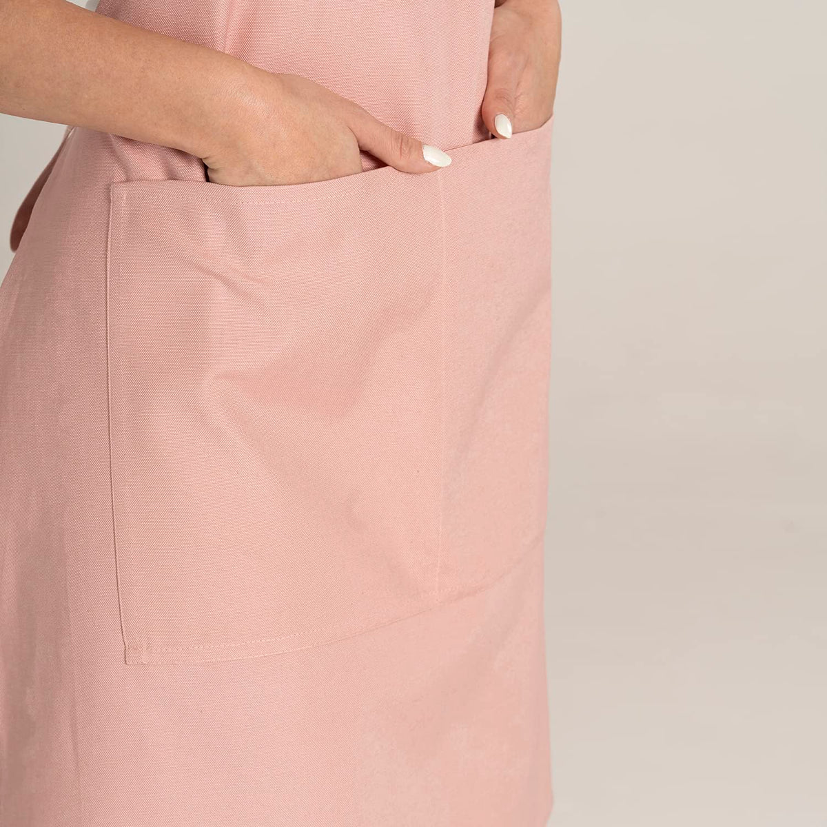 TOSHE Kitchen Apron brand label shows durable construction for everyday use.