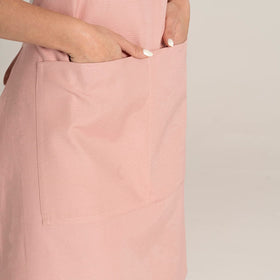 TOSHE Kitchen Apron brand label shows durable construction for everyday use.