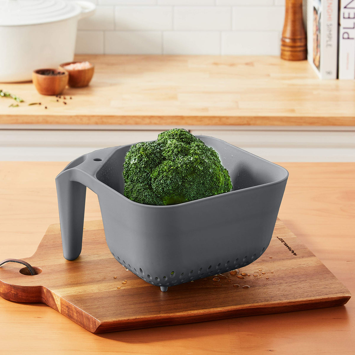 Small drain holes on the colander keep berries and rice safely inside.