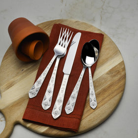 Towle Everyday Pueblo service for four arranged on a dining table for four.