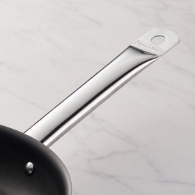 Tramontina nonstick interior with reinforced coating enables effortless sauté and cleanup.
