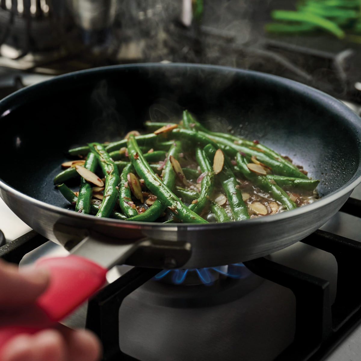Tramontina Professional 10-Inch ceramic pan handle close-up showing silicone sleeve