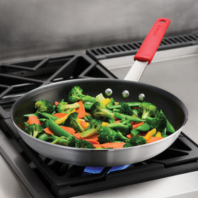 Tramontina Professional heavy-gauge aluminum ensures consistent heat.