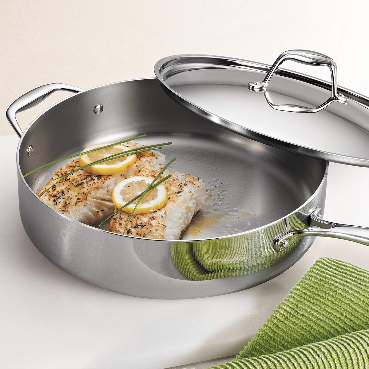 Tramontina Signature tri-ply pan with lid on seals heat and moisture.