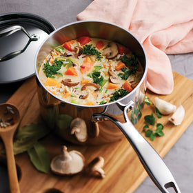 Tramontina Signature tri-ply on induction cooktop for versatile cooking.