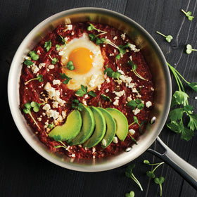 Tramontina Signature Tri-Ply cookware on an induction-ready stove