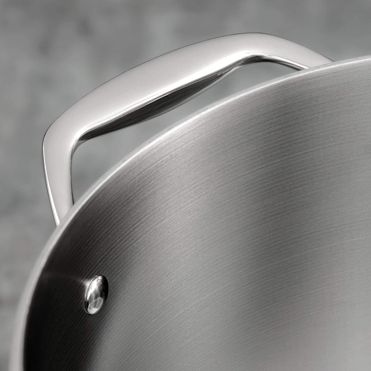 Tramontina tri-ply stock pot riveted handles for secure lifting