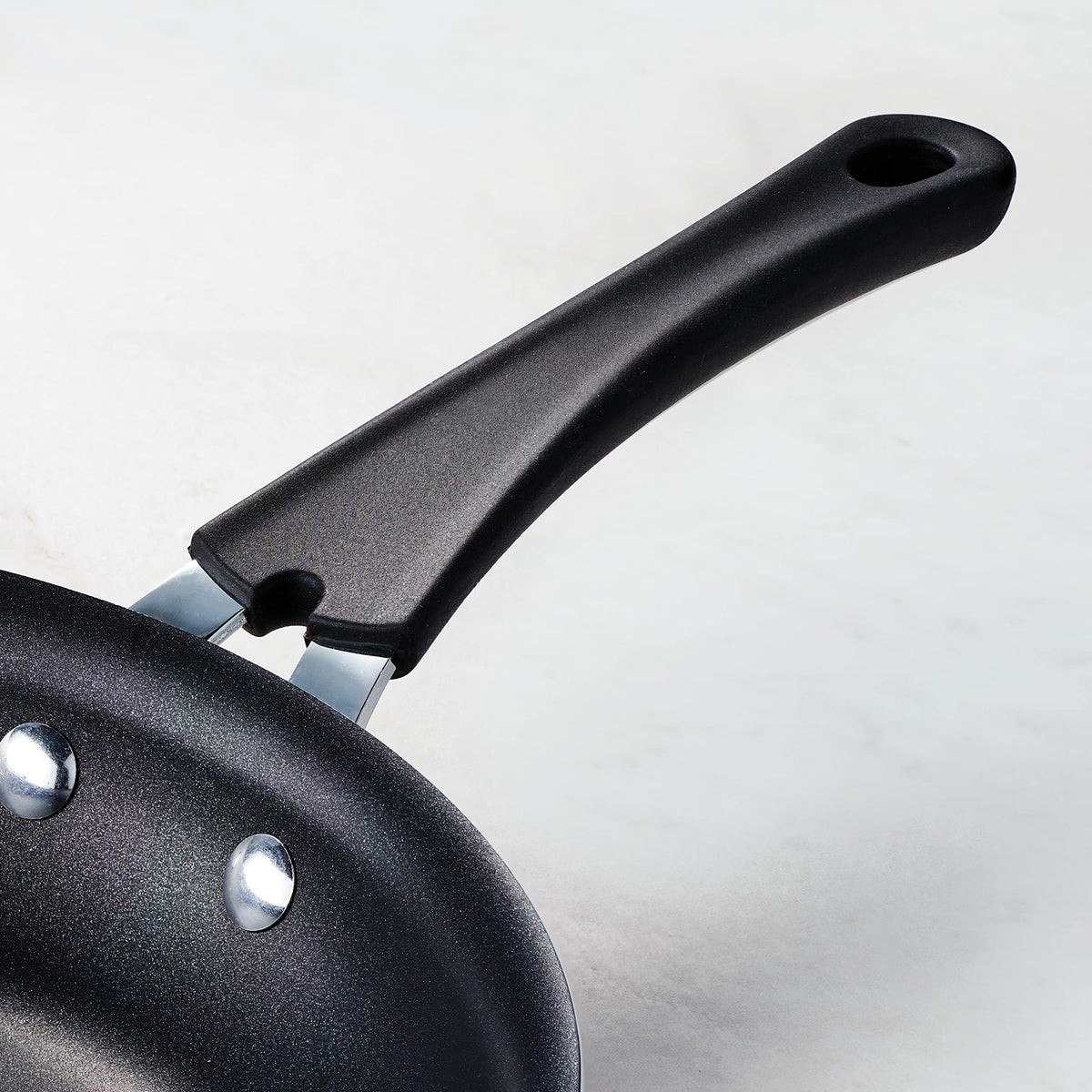 Tramontina teal reinforced nonstick surface close-up for smooth release