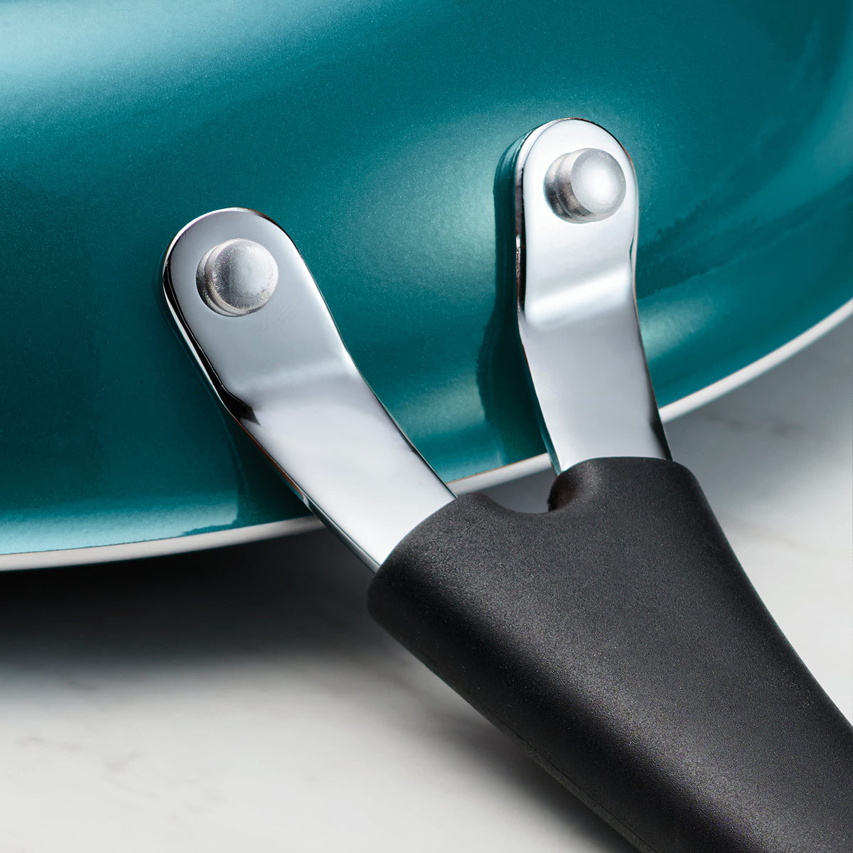 Tramontina teal fry pan with soft-grip handle for comfortable cooking