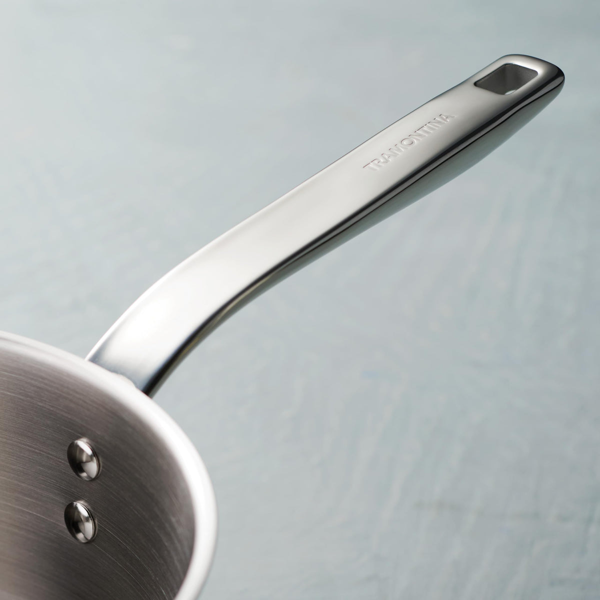 Tramontina Tempo riveted stainless-steel handle ensures a secure grip.
