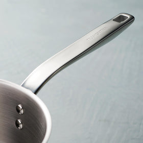 Tramontina Tempo riveted stainless-steel handle ensures a secure grip.