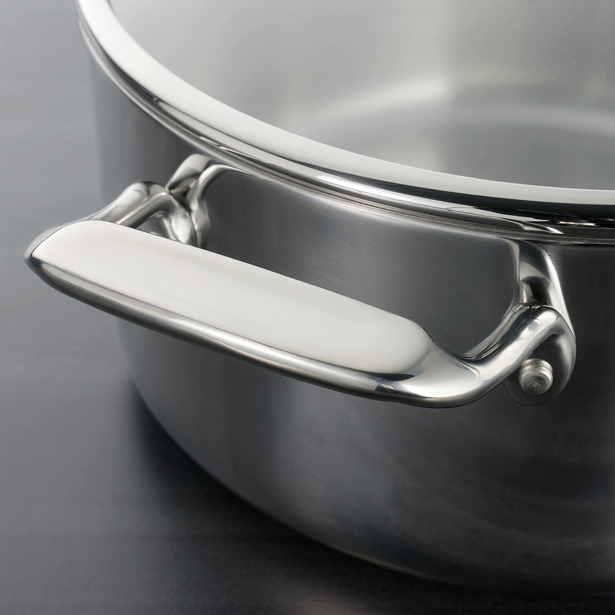 Tramontina 6-Qt braiser on induction stove for reliable cooking
