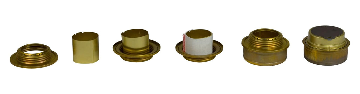 Trangia Spirit Burner in use on a camping stove setup for boiling water