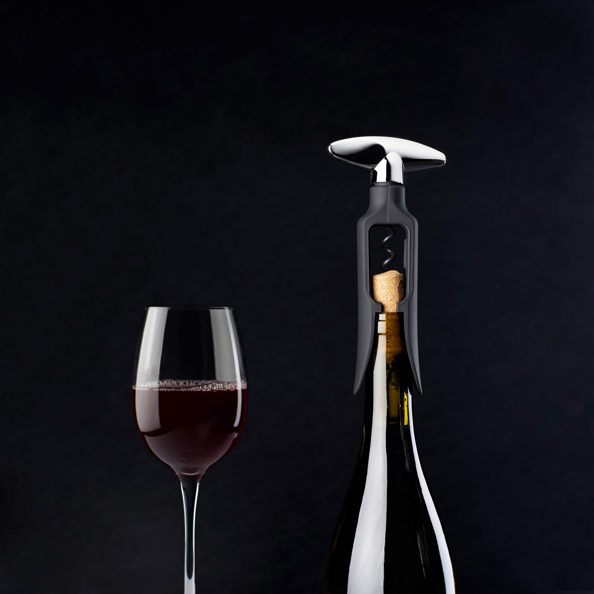 TRUE Self-Pulling Corkscrew on a patio setup for outdoor gatherings