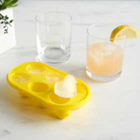 Duck-shaped ice tray on a stylish bar cart for entertaining