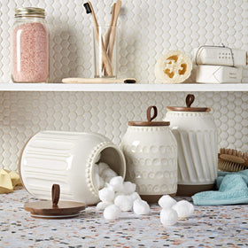 TTU Ziggy white medium canister with acacia lid keeps pantry items fresh.