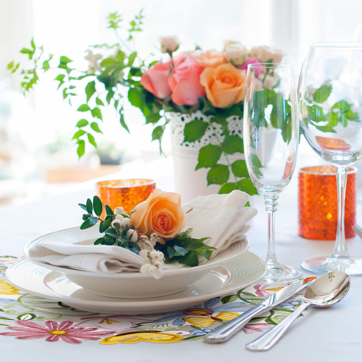 Tudomro spring dining setup with embroidered placemats