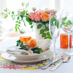 Tudomro spring dining setup with embroidered placemats