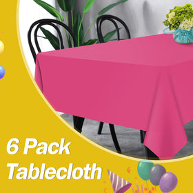 Tujol hot pink 54x108 tablecloth at an outdoor picnic for mess protection.