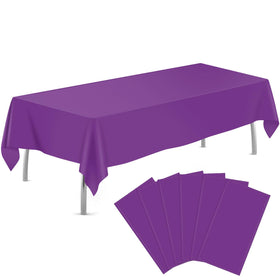 Tujol Purple 54x108 tablecloth spread on a table to prevent spills.