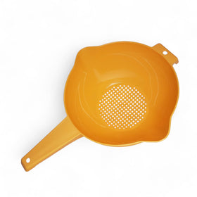 Tupperware 2-quart orange-handled colander viewed from top for easy rinsing.