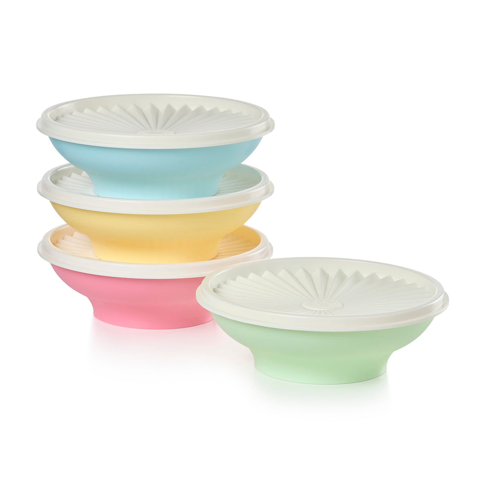 Tupperware Heritage bowls with lids nest for compact storage and quick access.