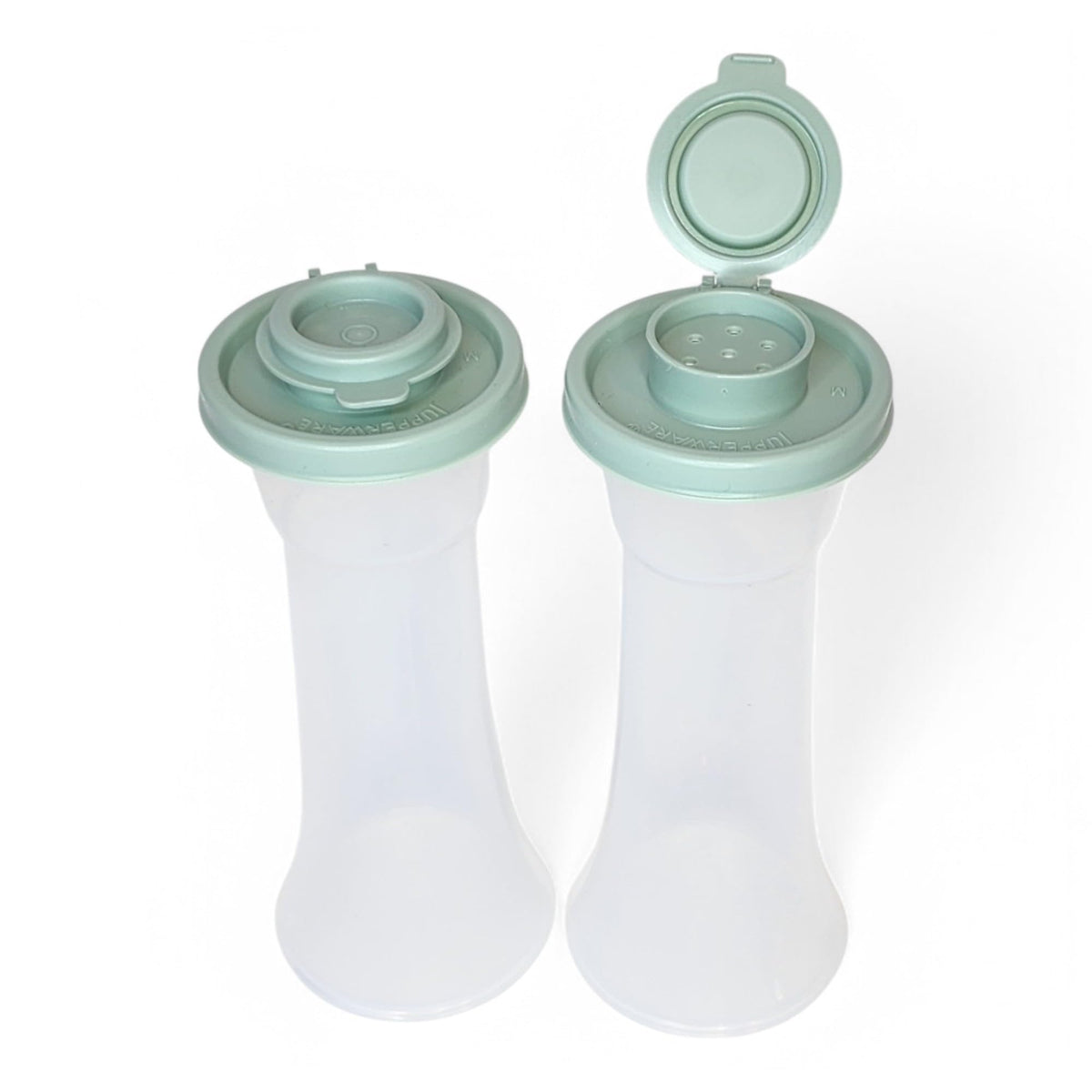 Closeup of sage green seal on Tupperware hourglass shaker highlighting airtight freshness.