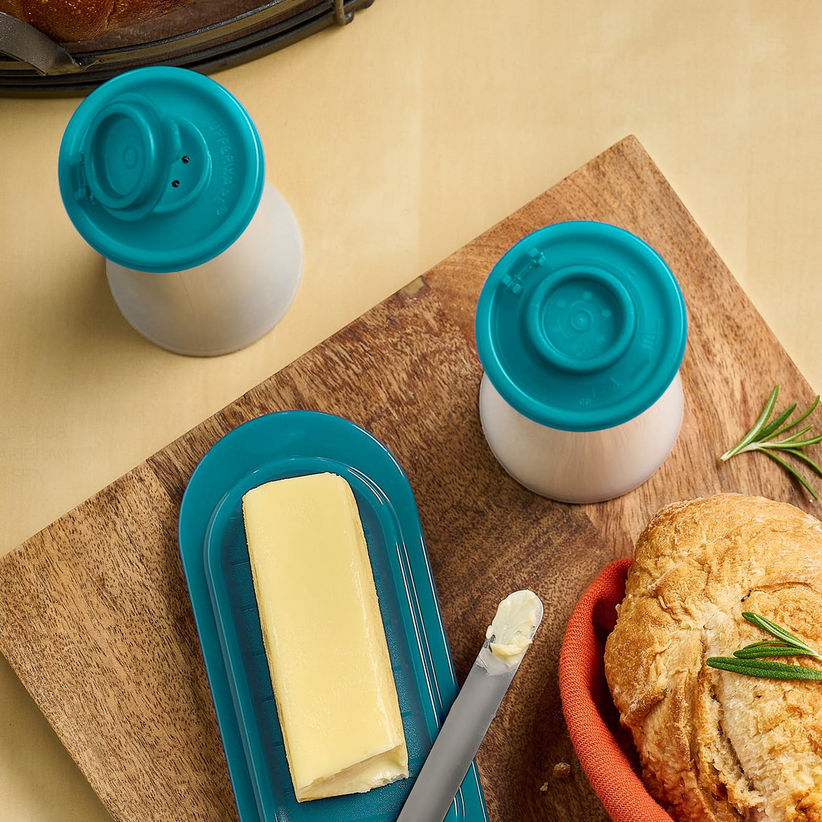 Stylish teal hourglass shakers enhance table presentation.