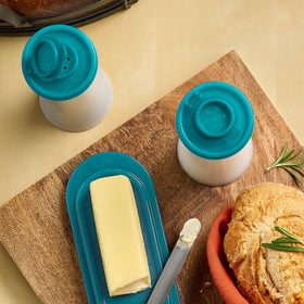 Stylish teal hourglass shakers enhance table presentation.