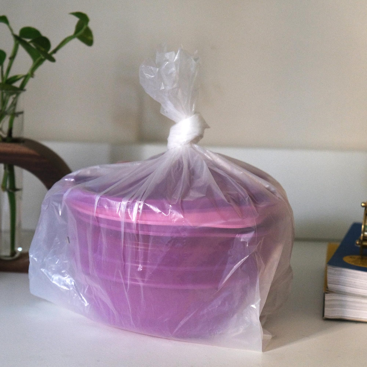 Tupperware Leftover Bowl Set comes in pink and purple hues.
