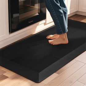 Tyrot anti-fatigue mat in kitchen sink area cushions feet during prep.