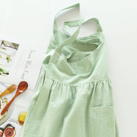 Uaussi cotton linen cross-back apron light green front view with wrap-around straps