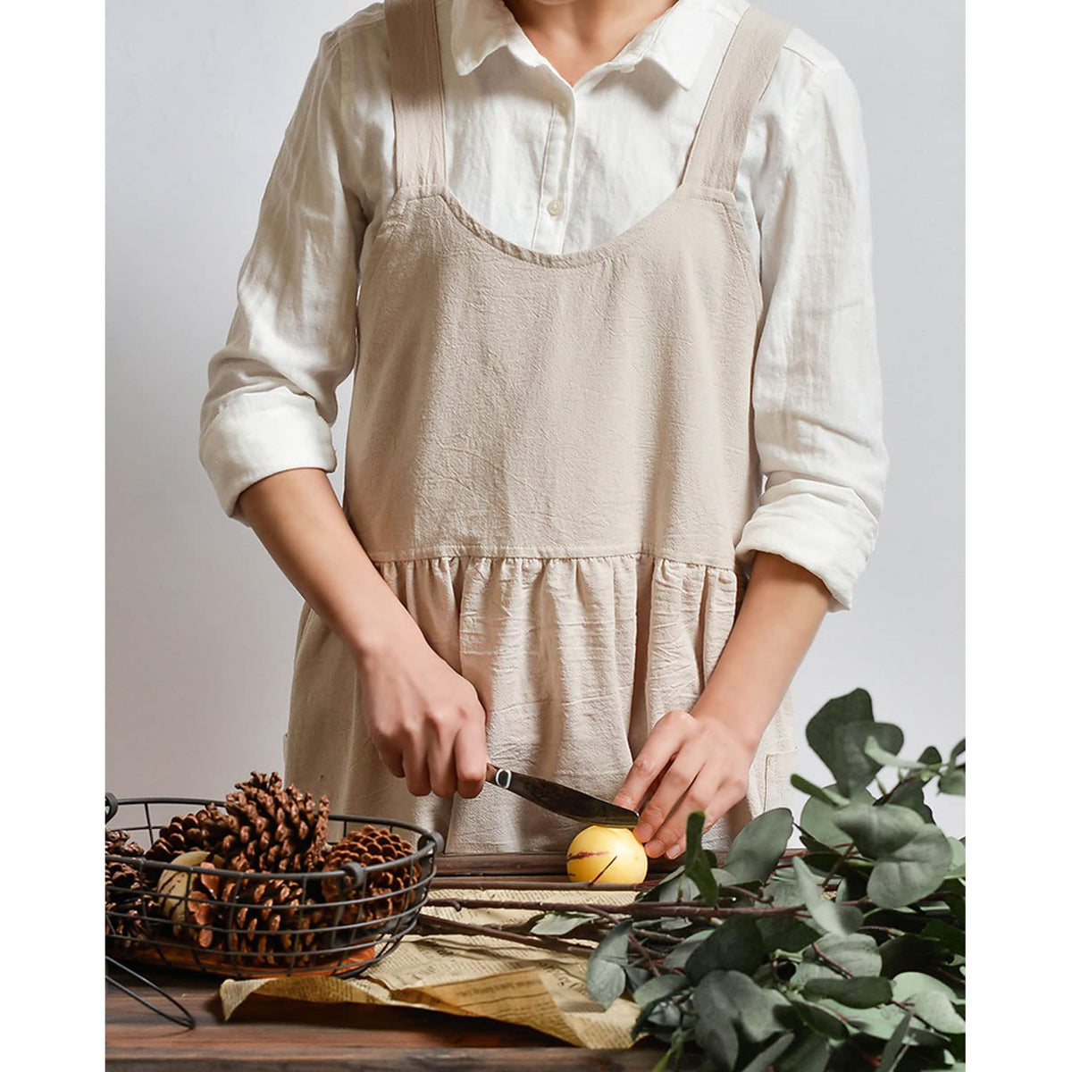 Uaussi full-length apron provides wrap-around protection during busy kitchen sessions