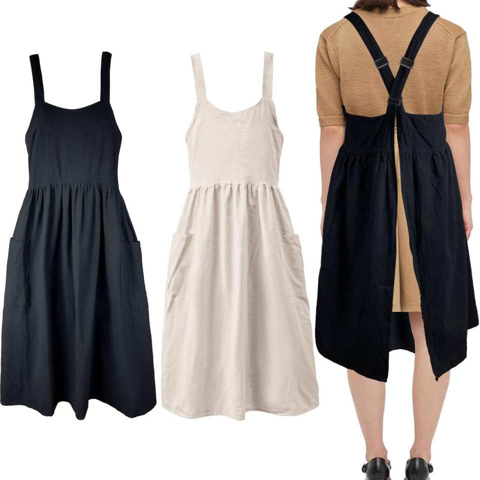 Uaussi cross-back apron with pockets for easy tool access during cooking.