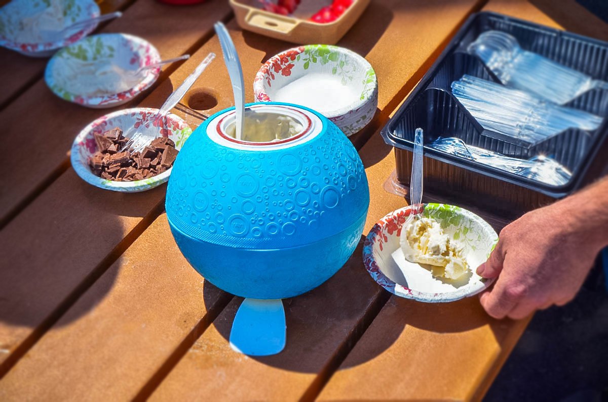 Filled with cream, sugar, and flavorings before shaking in the UCO Softshell Ice Cream Ball