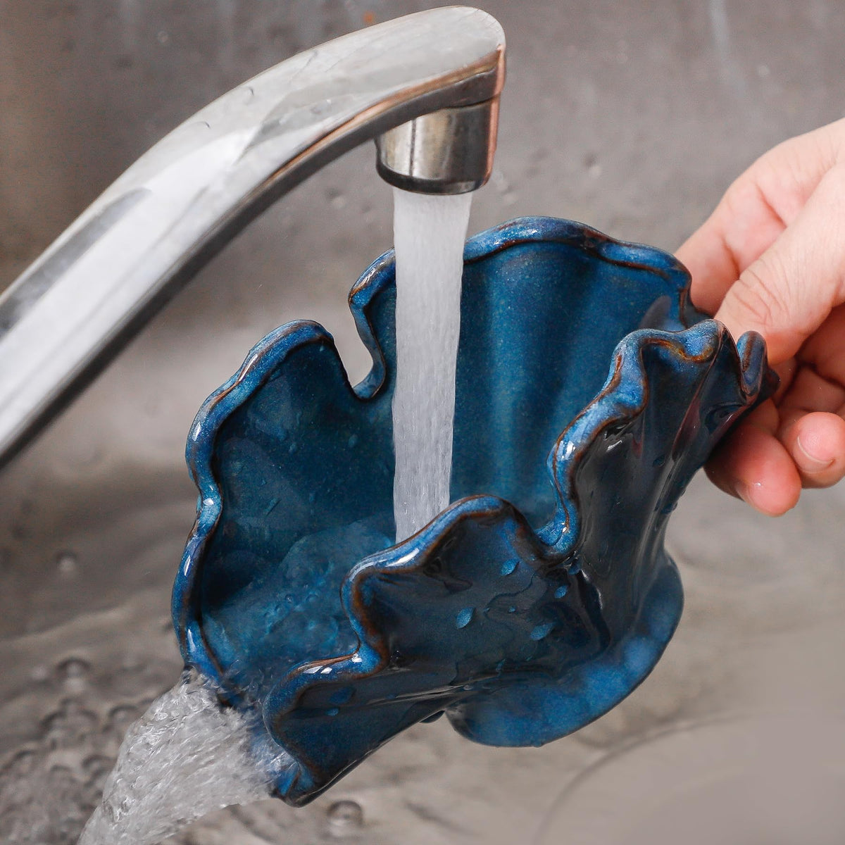 Uiddo sponge holder blue beside sink used to organize sponges near the wash area