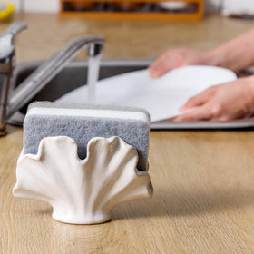 Uiddo sponge holder on sink with accessories, keeping sponges dry and clean.