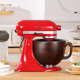 Elegant walnut bowl enhances both aesthetics and functionality on the counter.